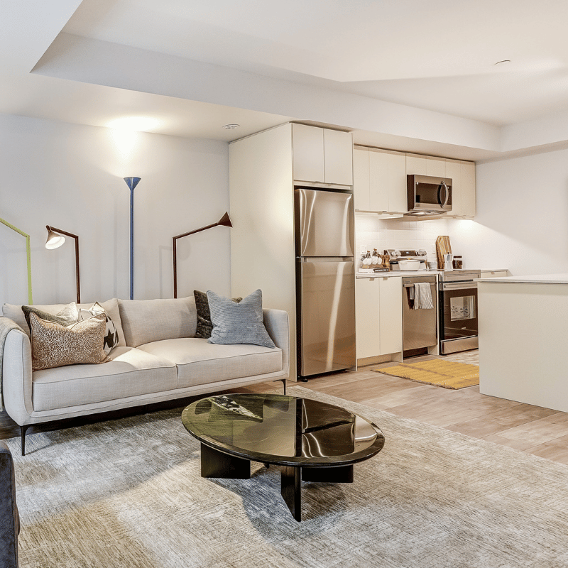 Staged living room and kitchen at The Towns at York Mills & Leslie.